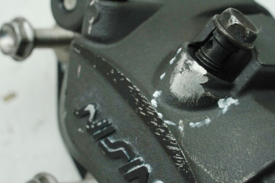KAWASAKI Z 650 ER650HA2 Bremssattel links Nissin Bremszange Bremskolben