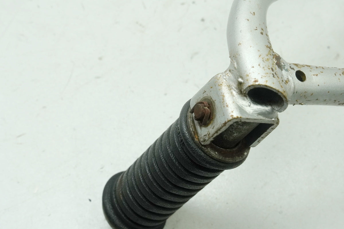 SUZUKI RG 125 NF12B GAMMA Footrest Pillion left Holder Footrest System
