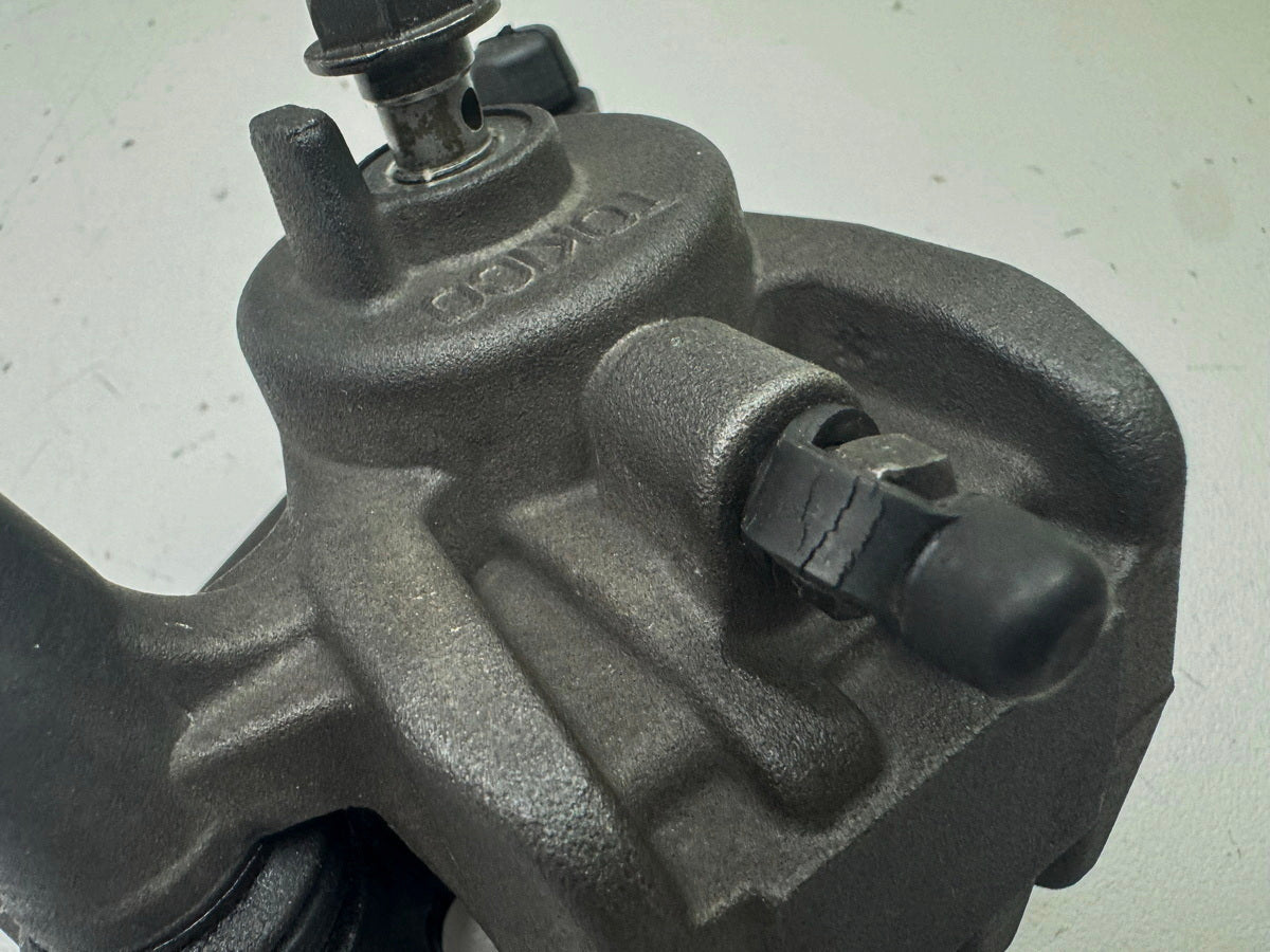 KAWASAKI ZX-10R ZXT00D Bremssattel hinten Tokico Bremskolben Bremszange 06-07
